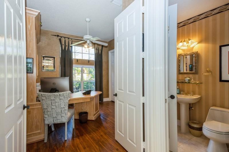 5900 Our Robbies Road Jupiter, FL 33458 - Photo 50 of 53 a view of a dining room with furniture window and wooden floor