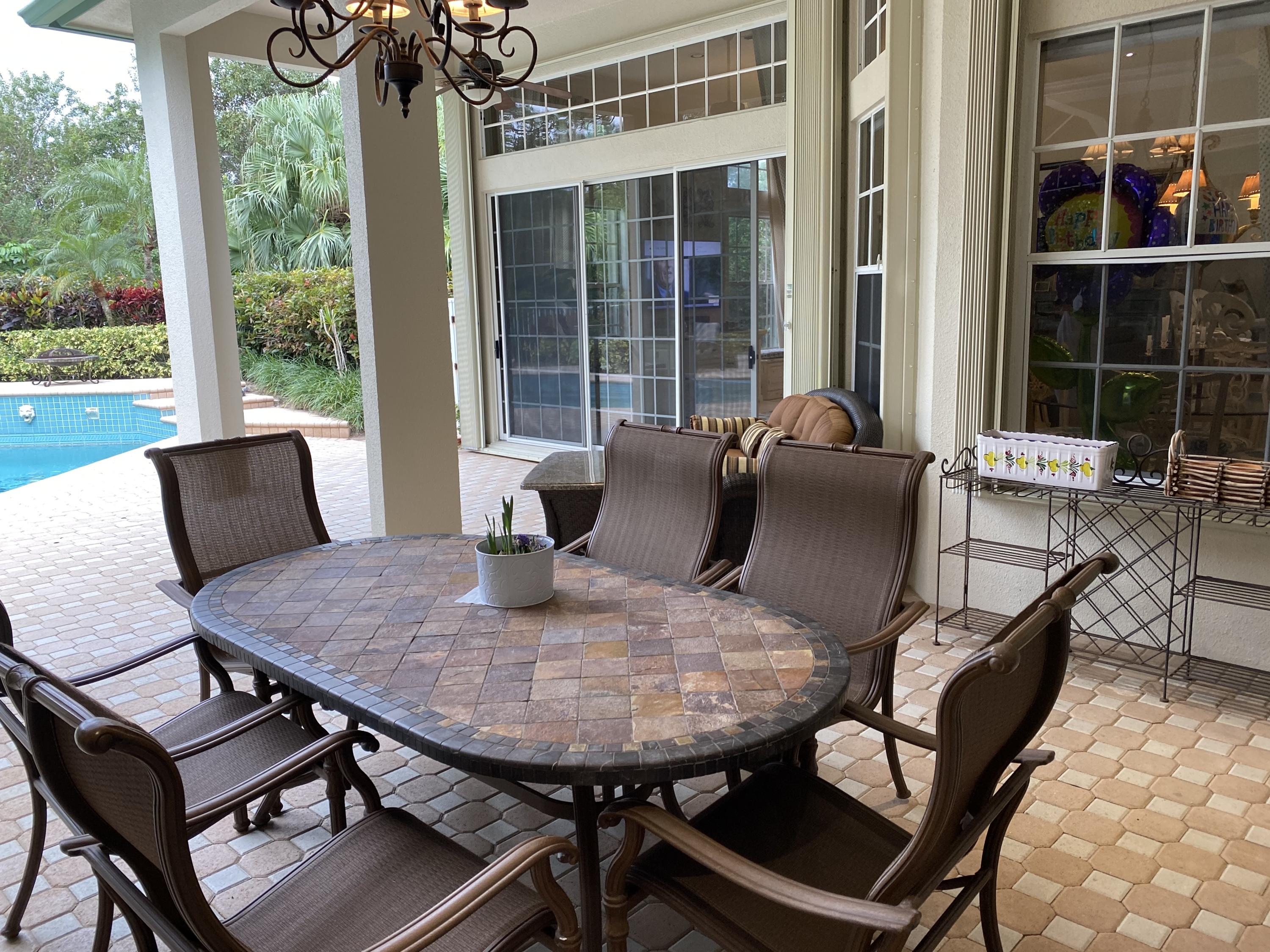 5900 Our Robbies Road Jupiter, FL 33458 - Photo 7 of 53 a view of a dining room with furniture window and outside view