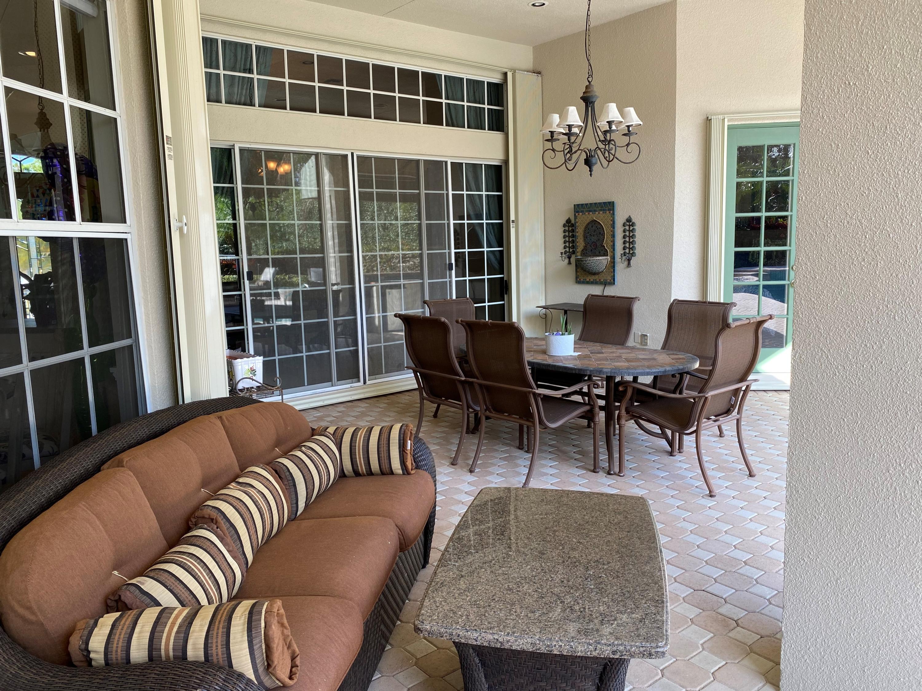 5900 Our Robbies Road Jupiter, FL 33458 - Photo 8 of 53 a living room with furniture and a large window