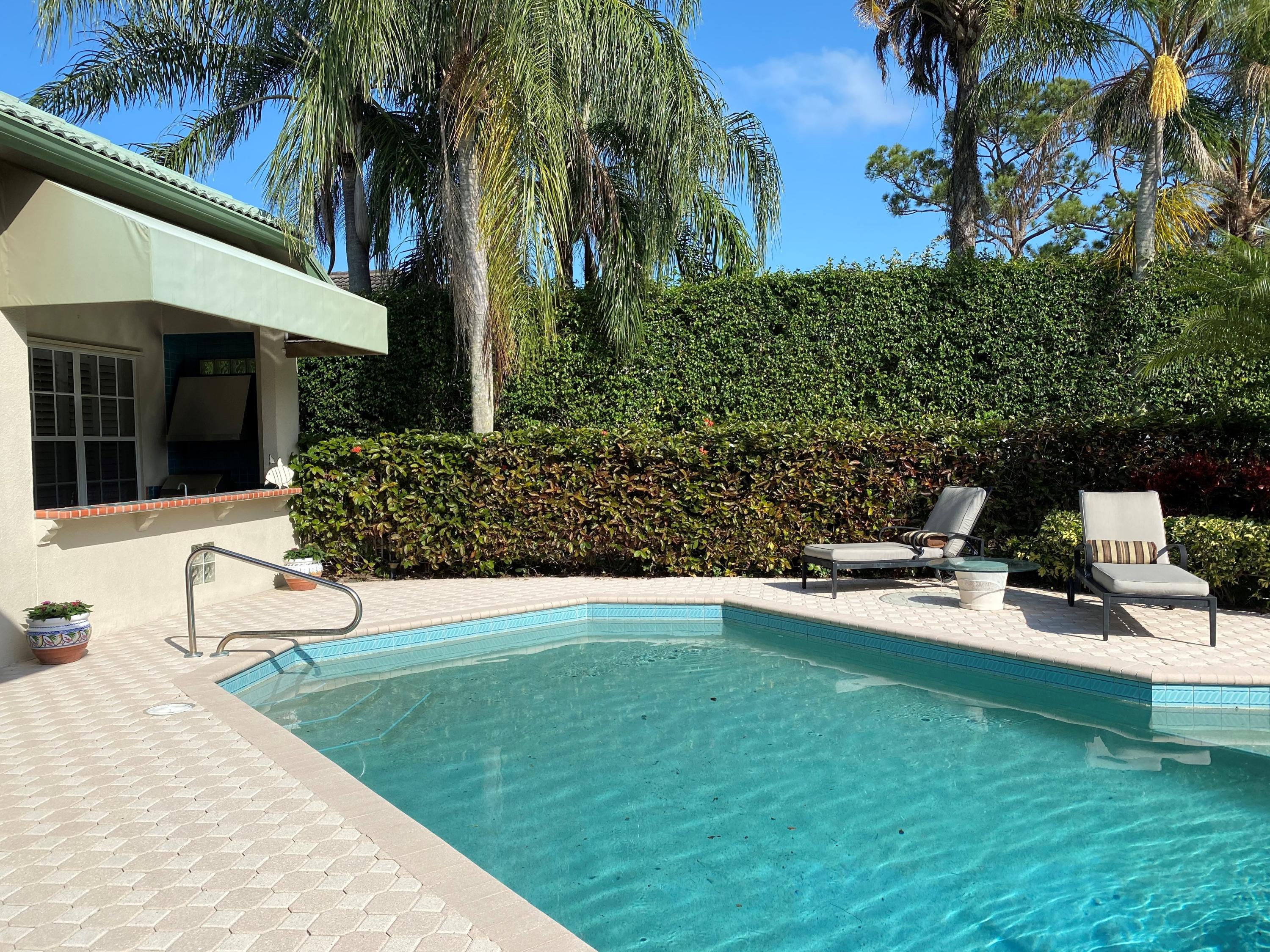 5900 Our Robbies Road Jupiter, FL 33458 - Photo 10 of 53 a view of a house with backyard porch and sitting area