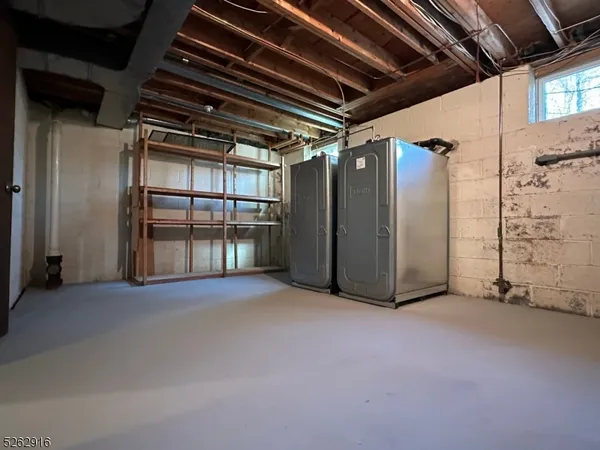 a view of an empty room with a fireplace