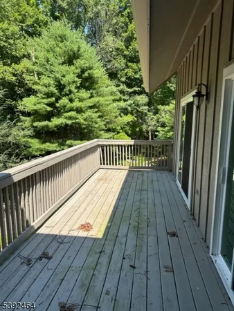a view of balcony with wooden floor