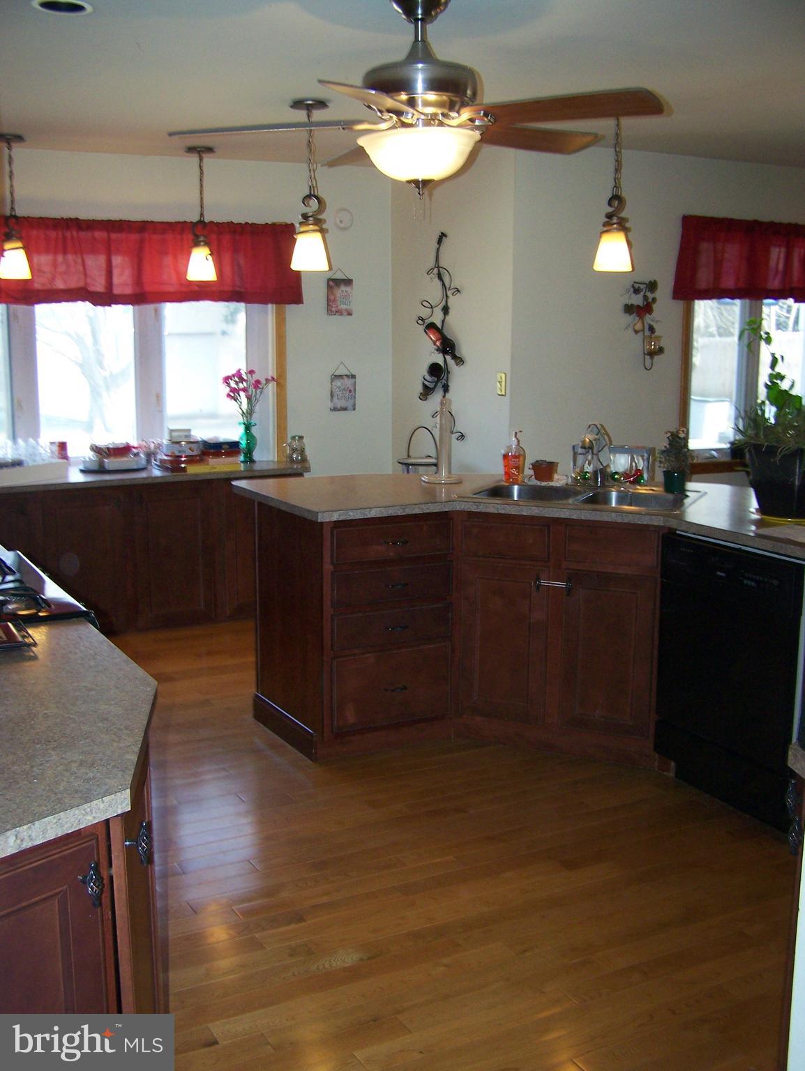 215 Windsor Road Robbinsville, NJ 08691 - Photo 6 of 34 a kitchen with a sink cabinets and wooden floor