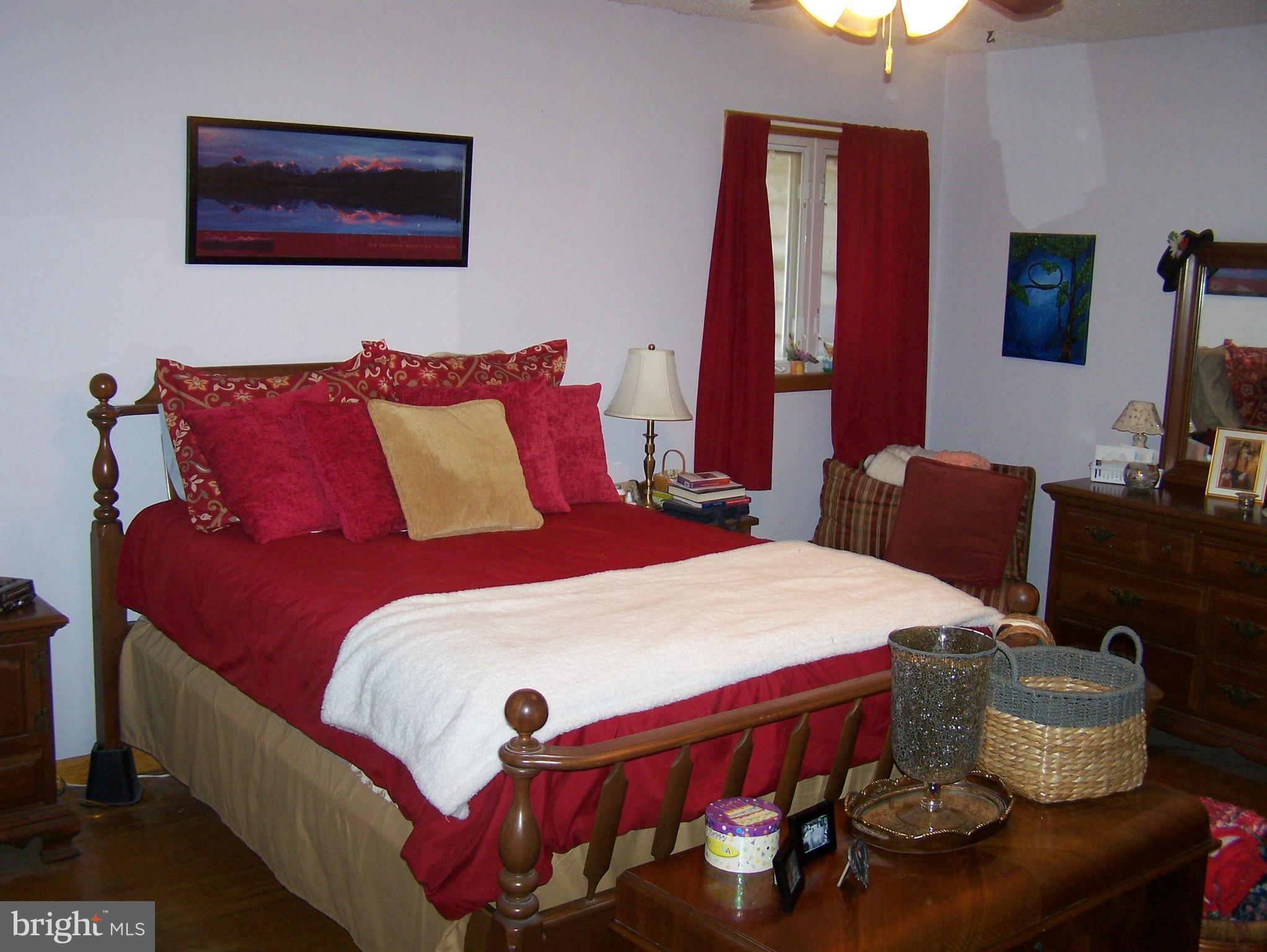 215 Windsor Road Robbinsville, NJ 08691 - Photo 10 of 34 a bedroom with a bed and a flat screen tv