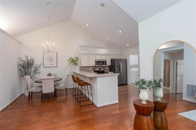 a dining room with furniture and window