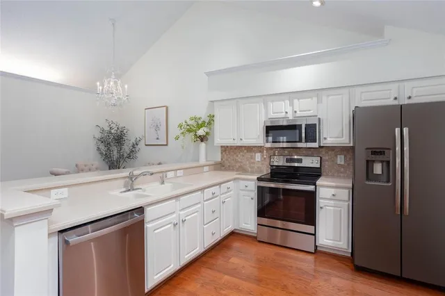 a view of storage and utility room with washer and dryer