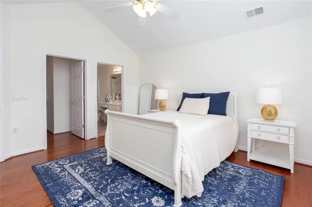 a bathroom with a sink toilet a mirror and shower