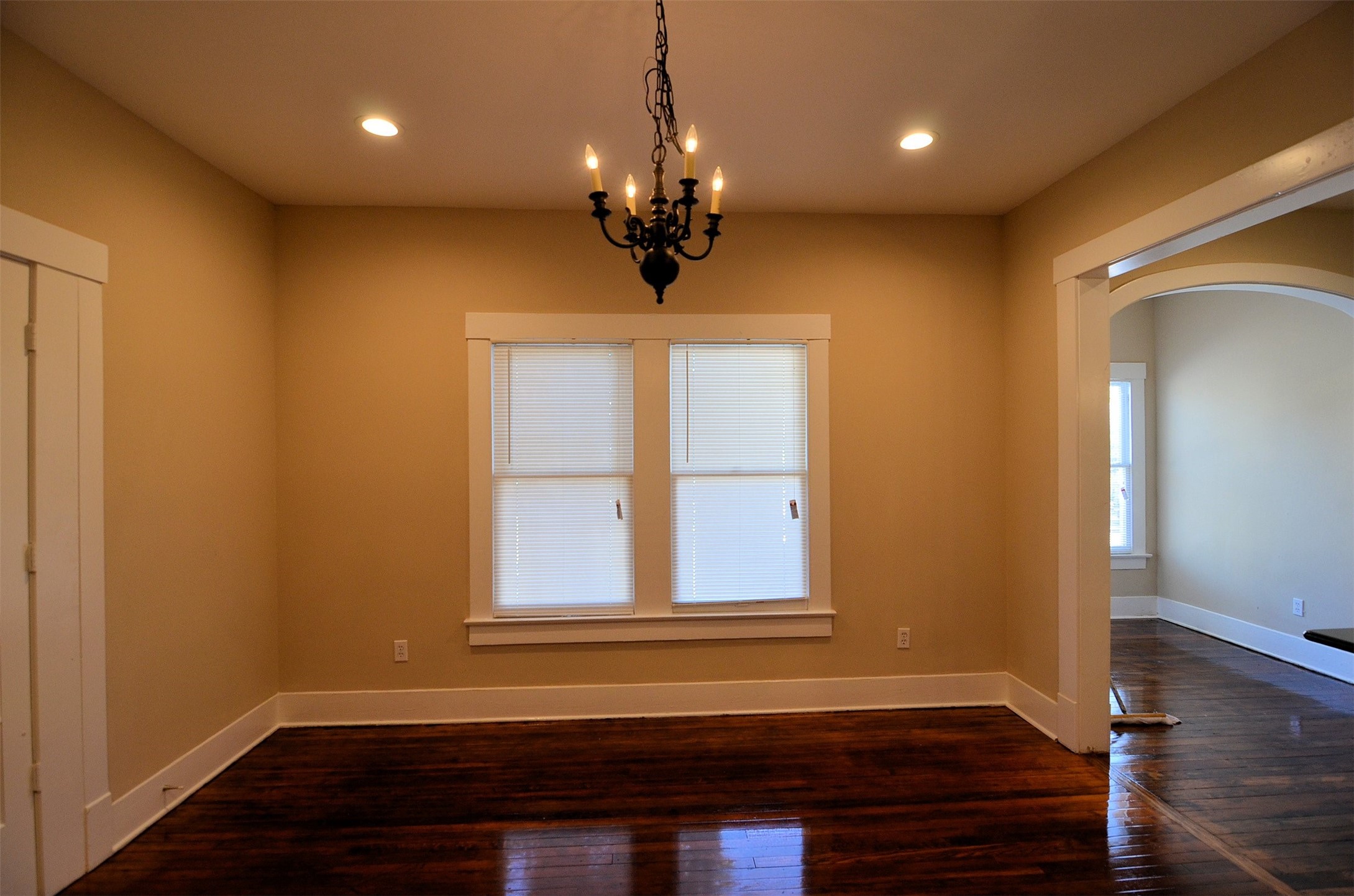 1602 Lee Street Houston, TX 77026 - Photo 11 of 26 a view of wooden floor and chandelier in a room