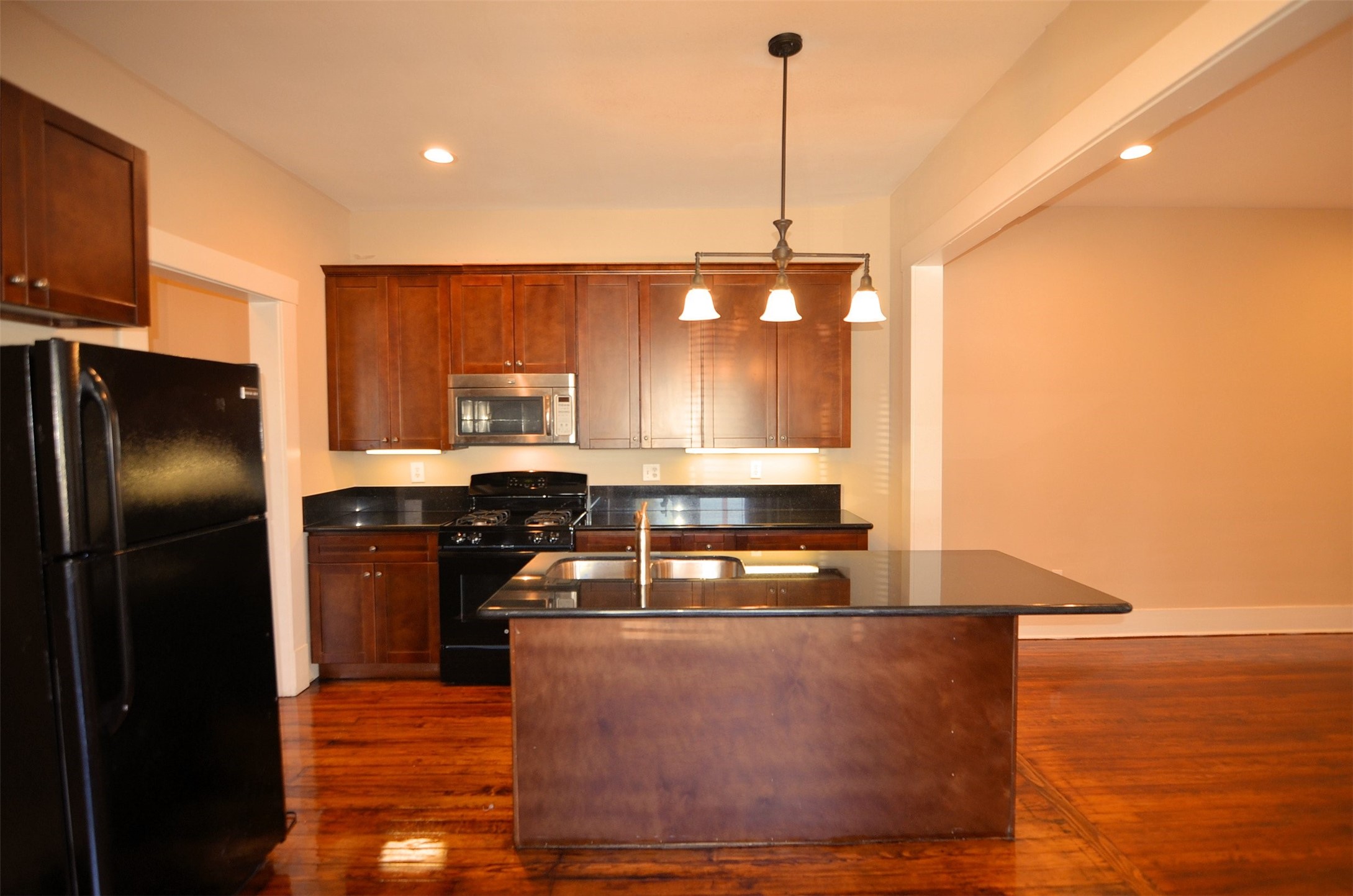 1602 Lee Street Houston, TX 77026 - Photo 14 of 26 a kitchen with stainless steel appliances granite countertop a refrigerator a sink and a stove