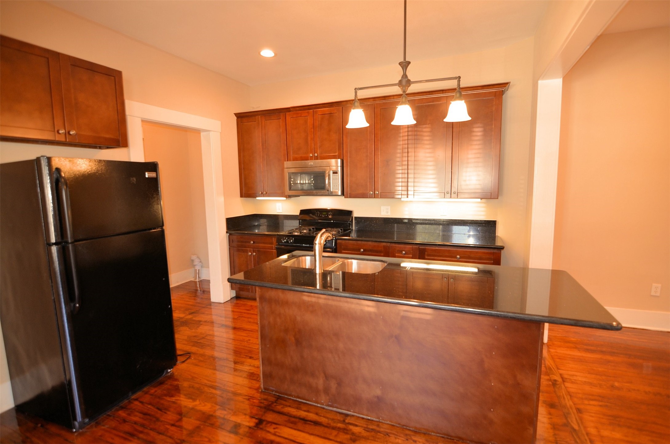 1602 Lee Street Houston, TX 77026 - Photo 16 of 26 a kitchen with a refrigerator a sink and a stove
