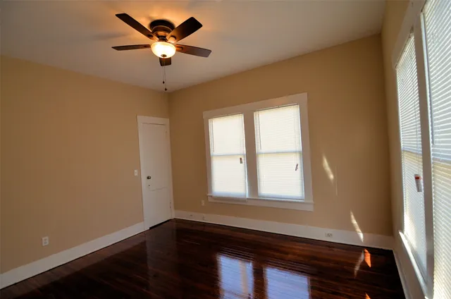 a room with window and ceiling fan