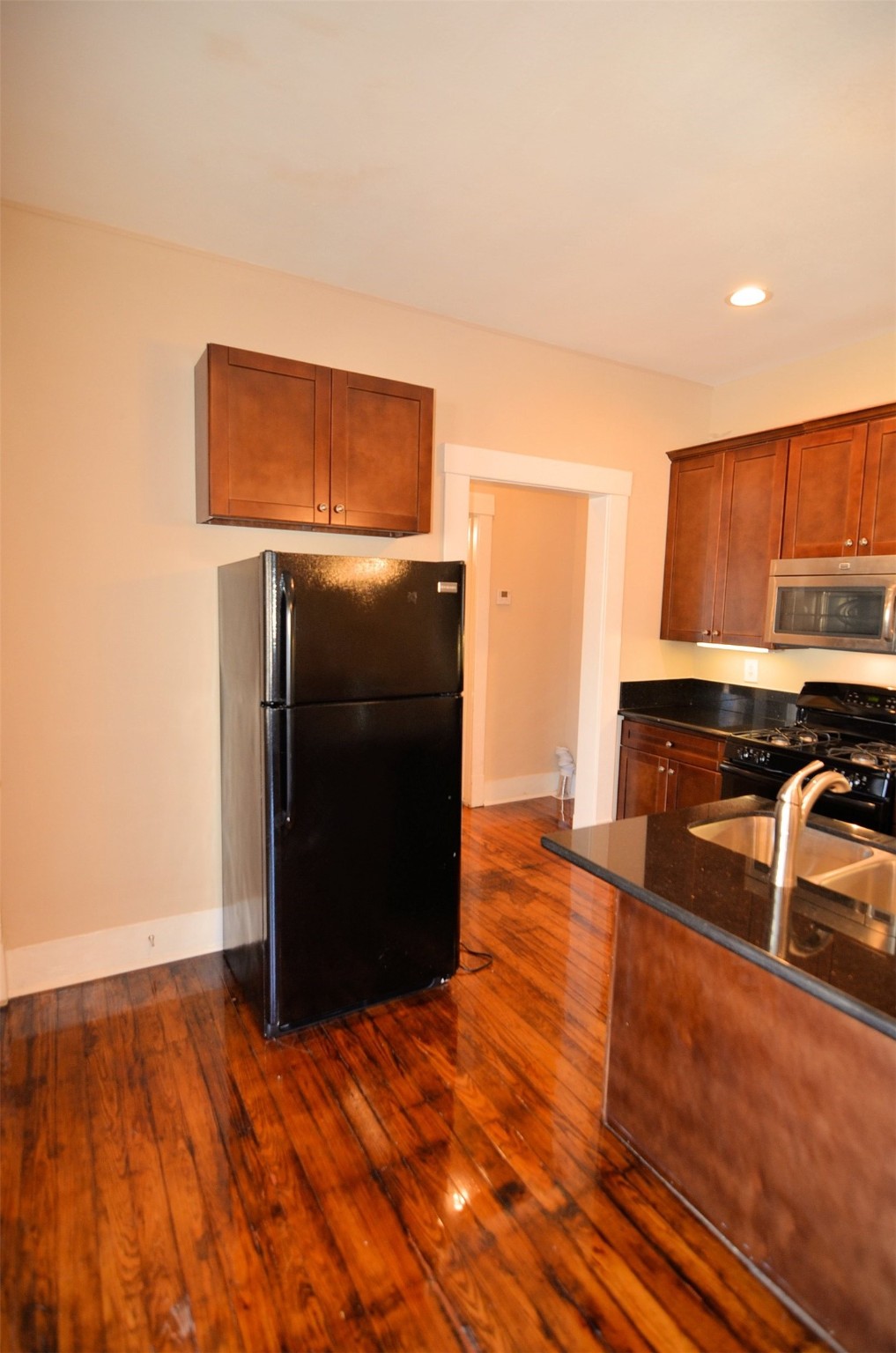 1602 Lee Street Houston, TX 77026 - Photo 4 of 26 a view of a kitchen with wooden floor