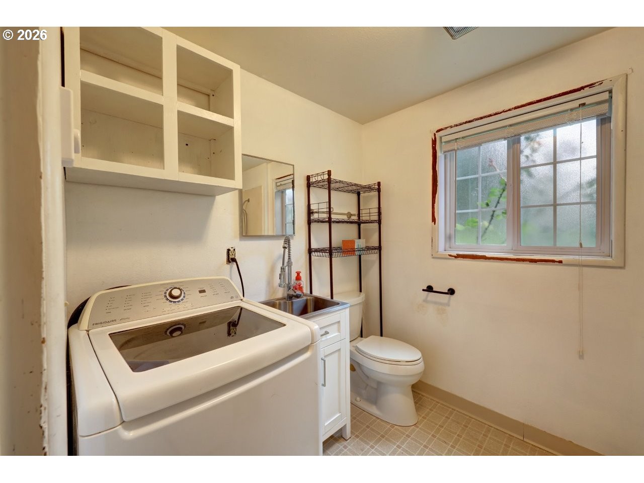 90835 McLean Hill Road Clatskanie, OR 97016 - Photo 12 of 22 a bathroom with a toilet sink and mirror