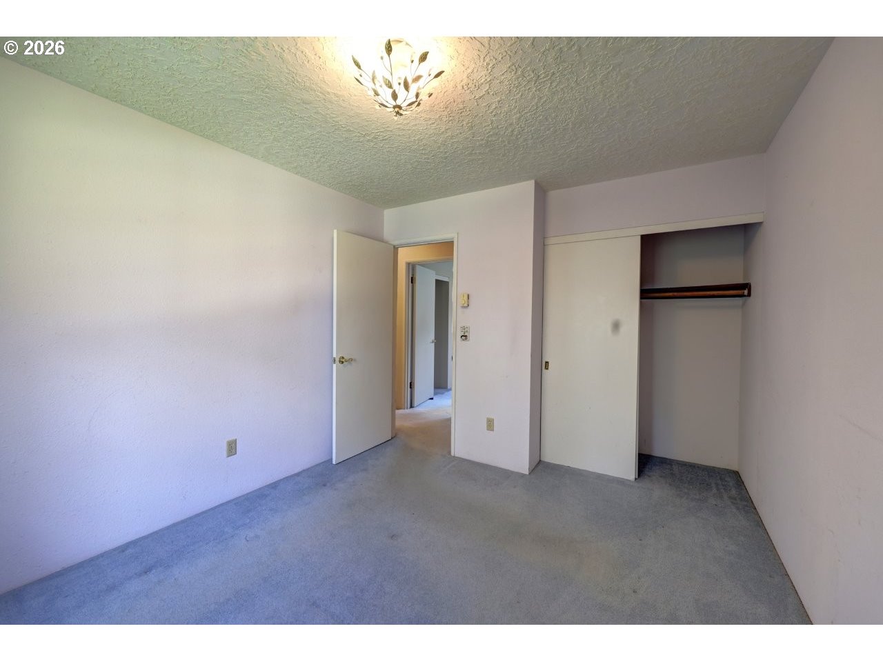 90835 McLean Hill Road Clatskanie, OR 97016 - Photo 16 of 22 a view of an empty room with a chandelier