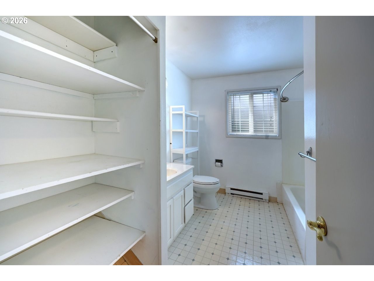 90835 McLean Hill Road Clatskanie, OR 97016 - Photo 17 of 22 a bathroom with a toilet sink a shower and a window