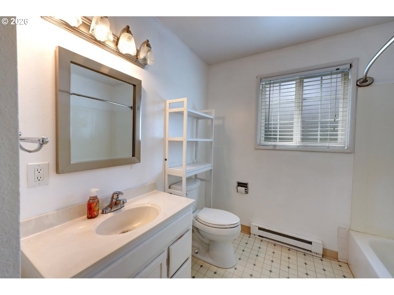 90835 McLean Hill Road Clatskanie, OR 97016 - Photo 18 of 22 a bathroom with a sink mirror toilet and next to a window