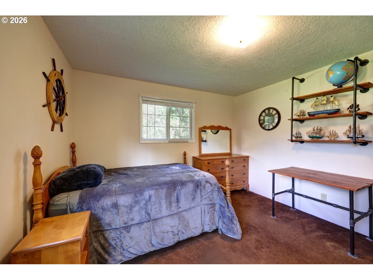 90835 McLean Hill Road Clatskanie, OR 97016 - Photo 10 of 22 a bedroom with a bed a window with the chair