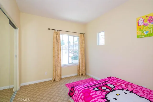 a bedroom with a bed and a table