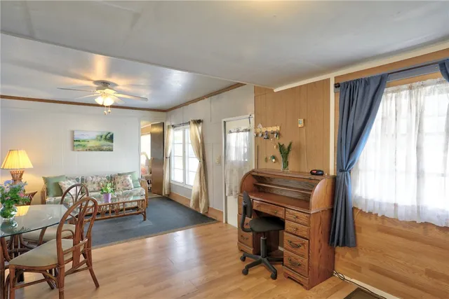 a bedroom with furniture and a window