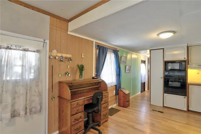a view of a livingroom with furniture and staircase