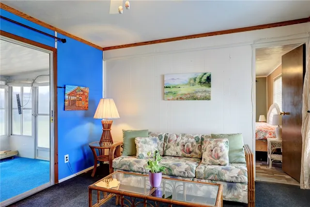 a living room with furniture and a lamp