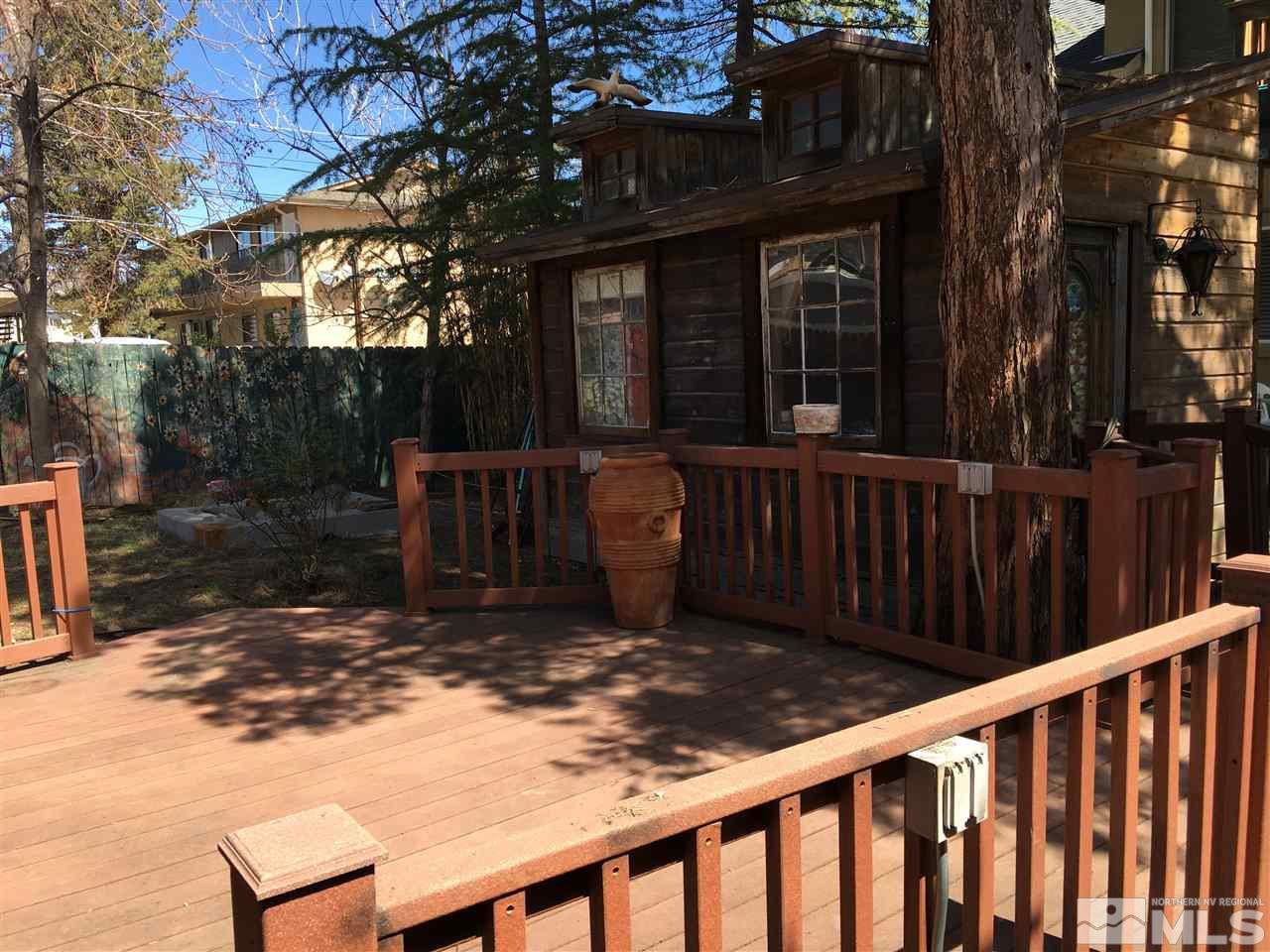 429 Burns Street Reno, NV 89502 - Photo 8 of 12 a view of a wooden deck with a bench