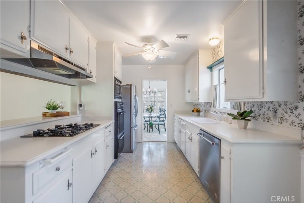 1355 East Level Street Covina, CA 91724 - Photo 11 of 30 a large kitchen with stainless steel appliances lots of counter space and wooden floor