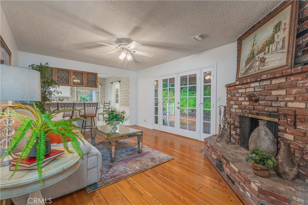 1355 East Level Street Covina, CA 91724 - Photo 15 of 31 a living room with furniture and a fireplace