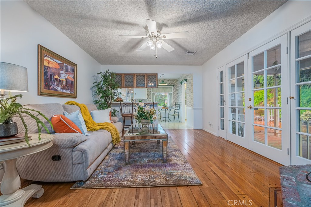 1355 East Level Street Covina, CA 91724 - Photo 16 of 31 a living room with furniture and a floor to ceiling window