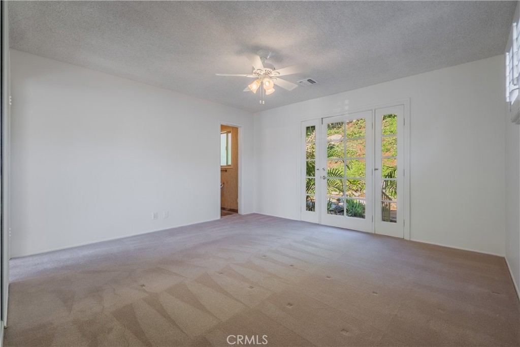 1355 East Level Street Covina, CA 91724 - Photo 16 of 30 a view of a livingroom with a ceiling fan and window