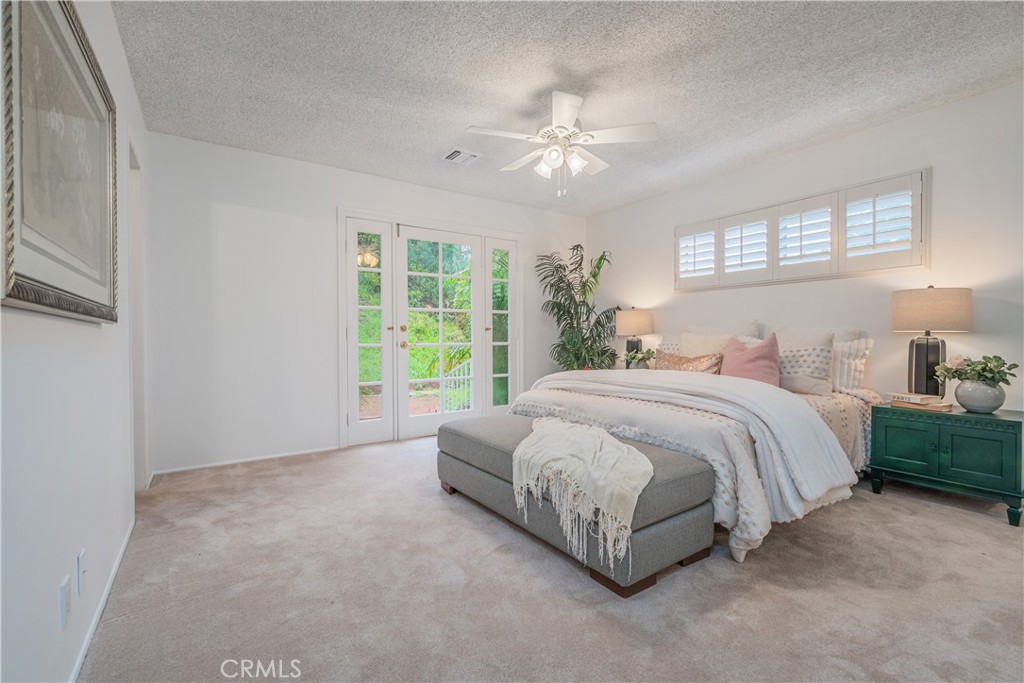 1355 East Level Street Covina, CA 91724 - Photo 17 of 31 a spacious bedroom with a bed and a chandelier