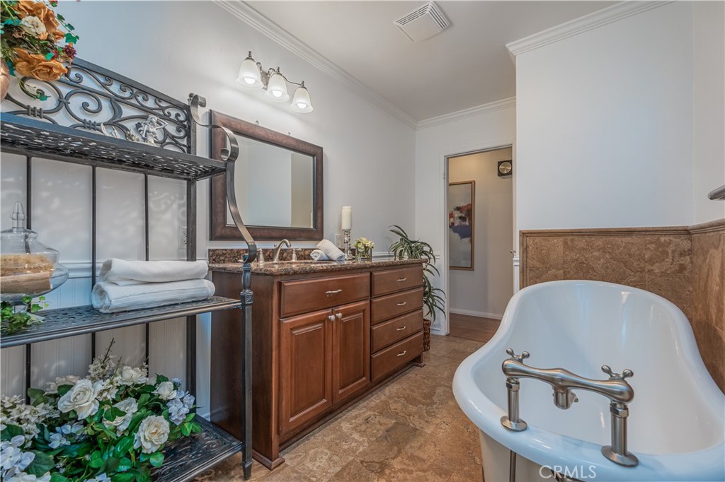 1355 East Level Street Covina, CA 91724 - Photo 21 of 31 a bathroom with a sink a mirror and a potted plant
