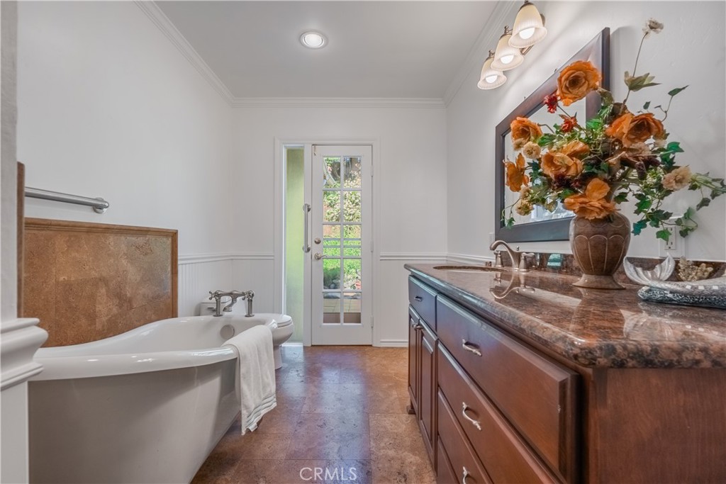 1355 East Level Street Covina, CA 91724 - Photo 21 of 30 a bathroom with a granite countertop sink a large mirror and a window