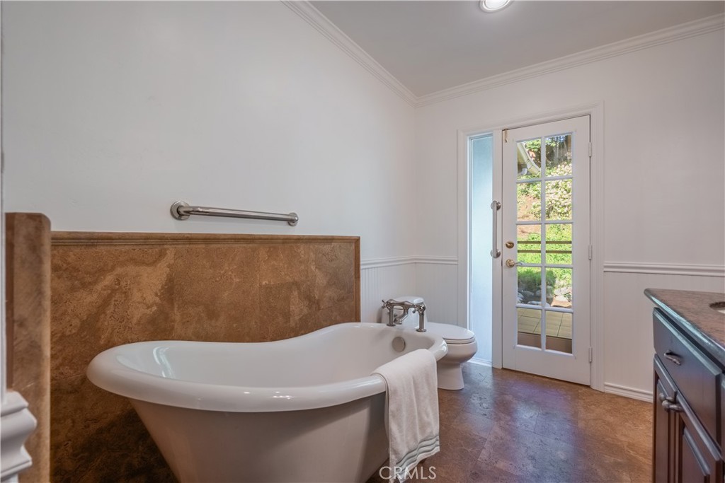1355 East Level Street Covina, CA 91724 - Photo 22 of 30 a bathroom with a white tub a sink and a mirror