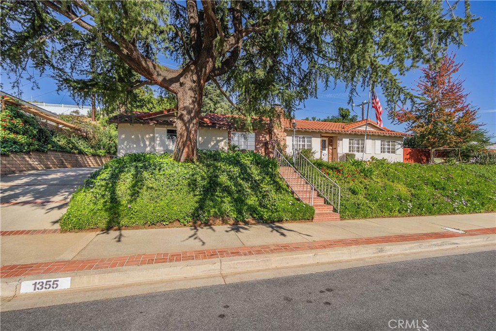 1355 East Level Street Covina, CA 91724 - Photo 3 of 31 front view of a house next to a road