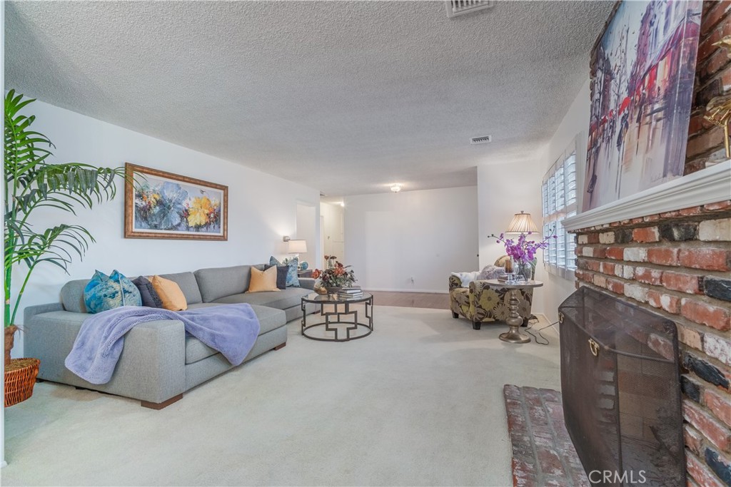 1355 East Level Street Covina, CA 91724 - Photo 5 of 31 a living room with furniture and a couch