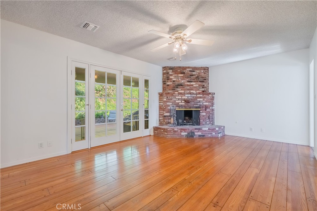 1355 East Level Street Covina, CA 91724 - Photo 8 of 30 a view of empty room with wooden floor and fan