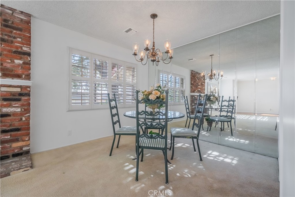 1355 East Level Street Covina, CA 91724 - Photo 9 of 30 a view of a dining room with furniture and chandelier