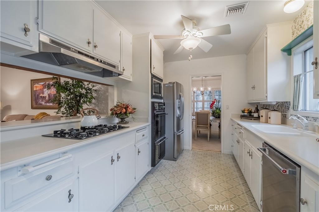 1355 East Level Street Covina, CA 91724 - Photo 9 of 31 a kitchen with stainless steel appliances kitchen island granite countertop a sink and cabinets