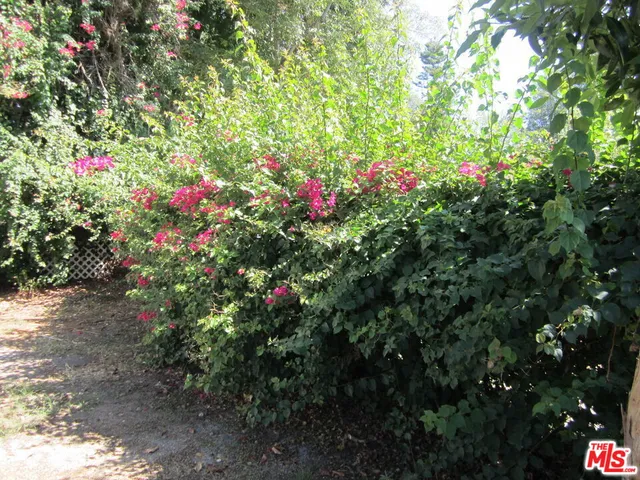 a view of kitchen with stainless steel appliances a refrigerator and stove top oven