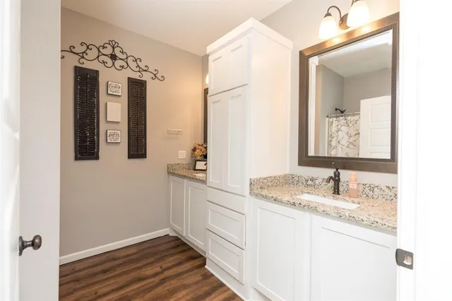a bathroom with a sink and a mirror