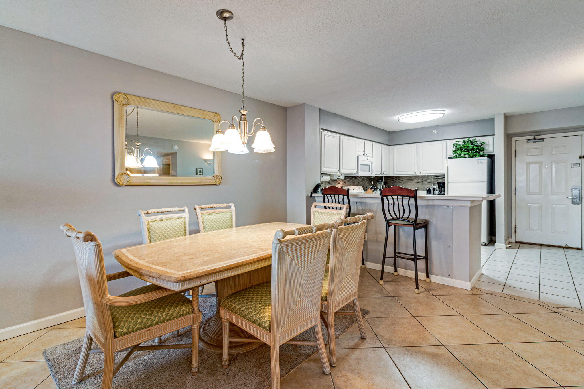970 Highway 98, Unit 303 Destin, FL 32541 - Photo 11 of 42 a view of a dining room with furniture