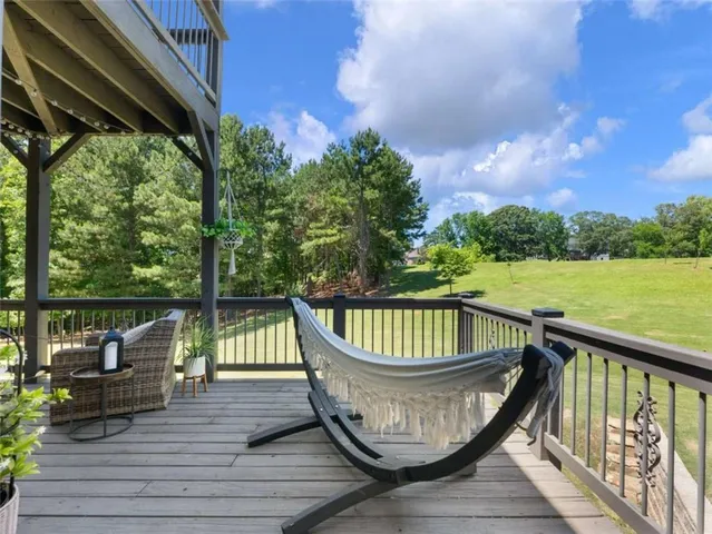 a view of roof deck with furniture