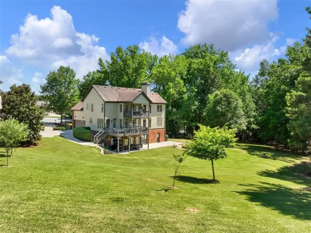 a view of a house with a yard porch and sitting area