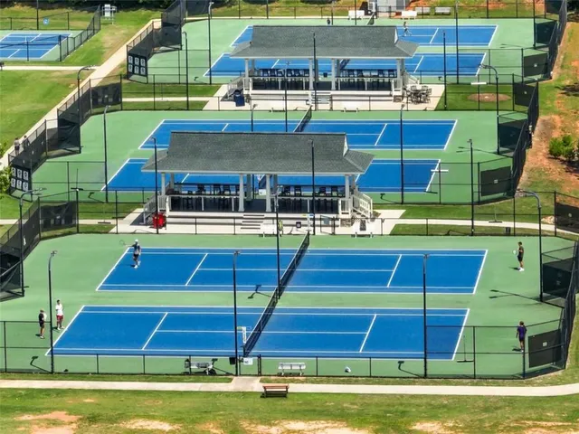 a view of a swimming pool with a yard