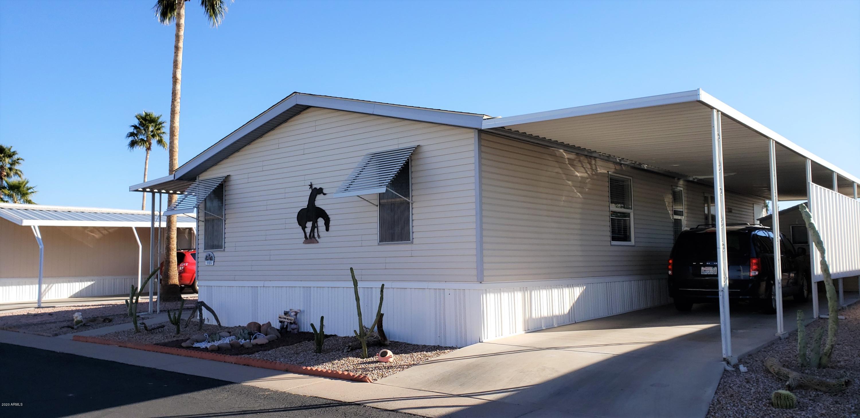 301 South Signal Butte Road, Unit 705 Apache Junction, AZ 85120 - Photo 1 of 50 a front view of a house with yard