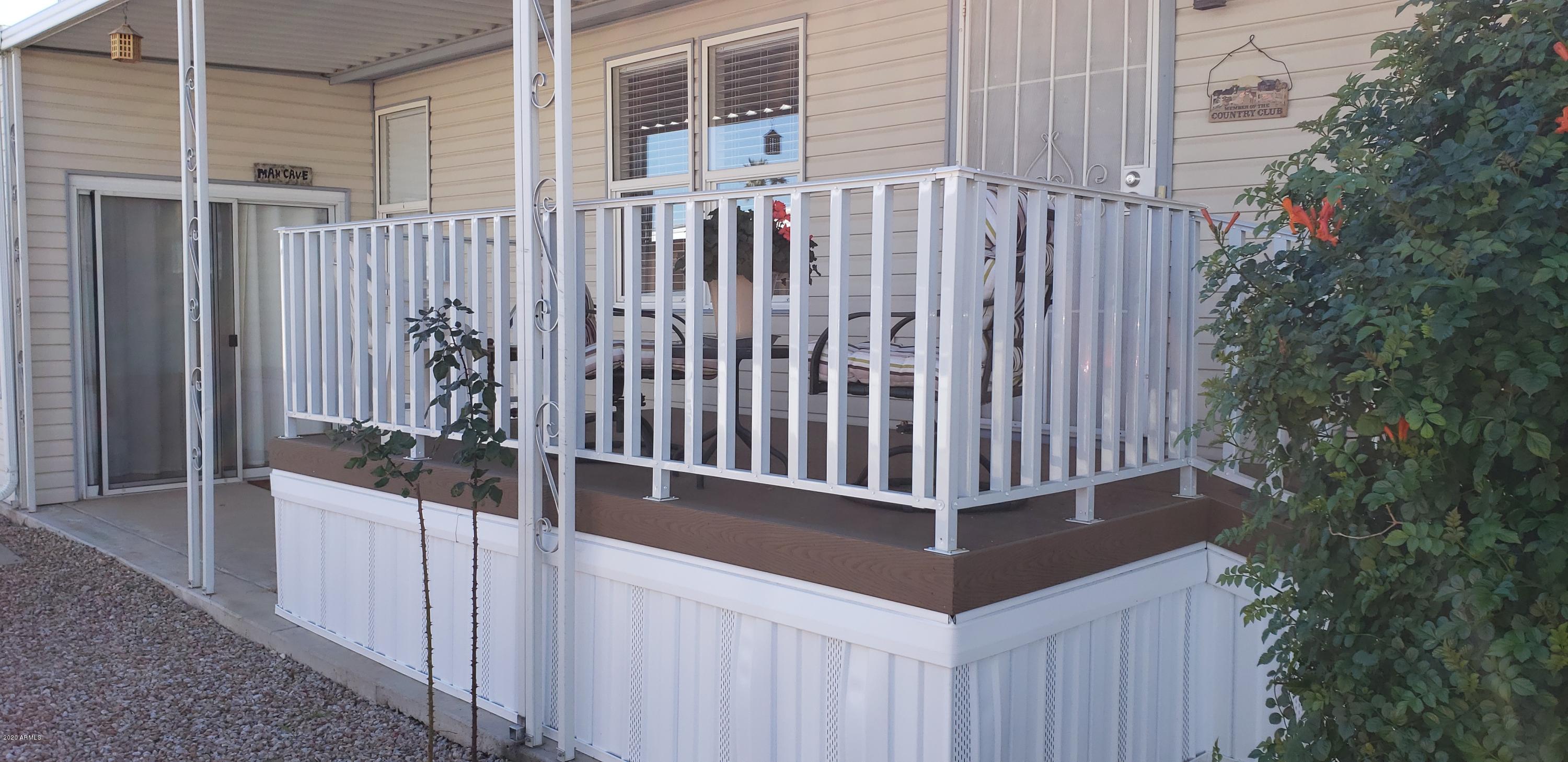 301 South Signal Butte Road, Unit 705 Apache Junction, AZ 85120 - Photo 31 of 50 a view of a balcony with wooden fence