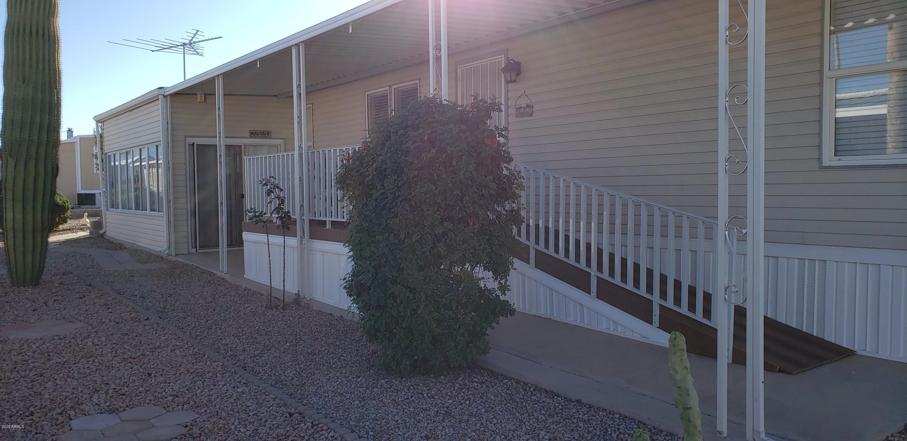 301 South Signal Butte Road, Unit 705 Apache Junction, AZ 85120 - Photo 4 of 50 a view of a wooden door of the house