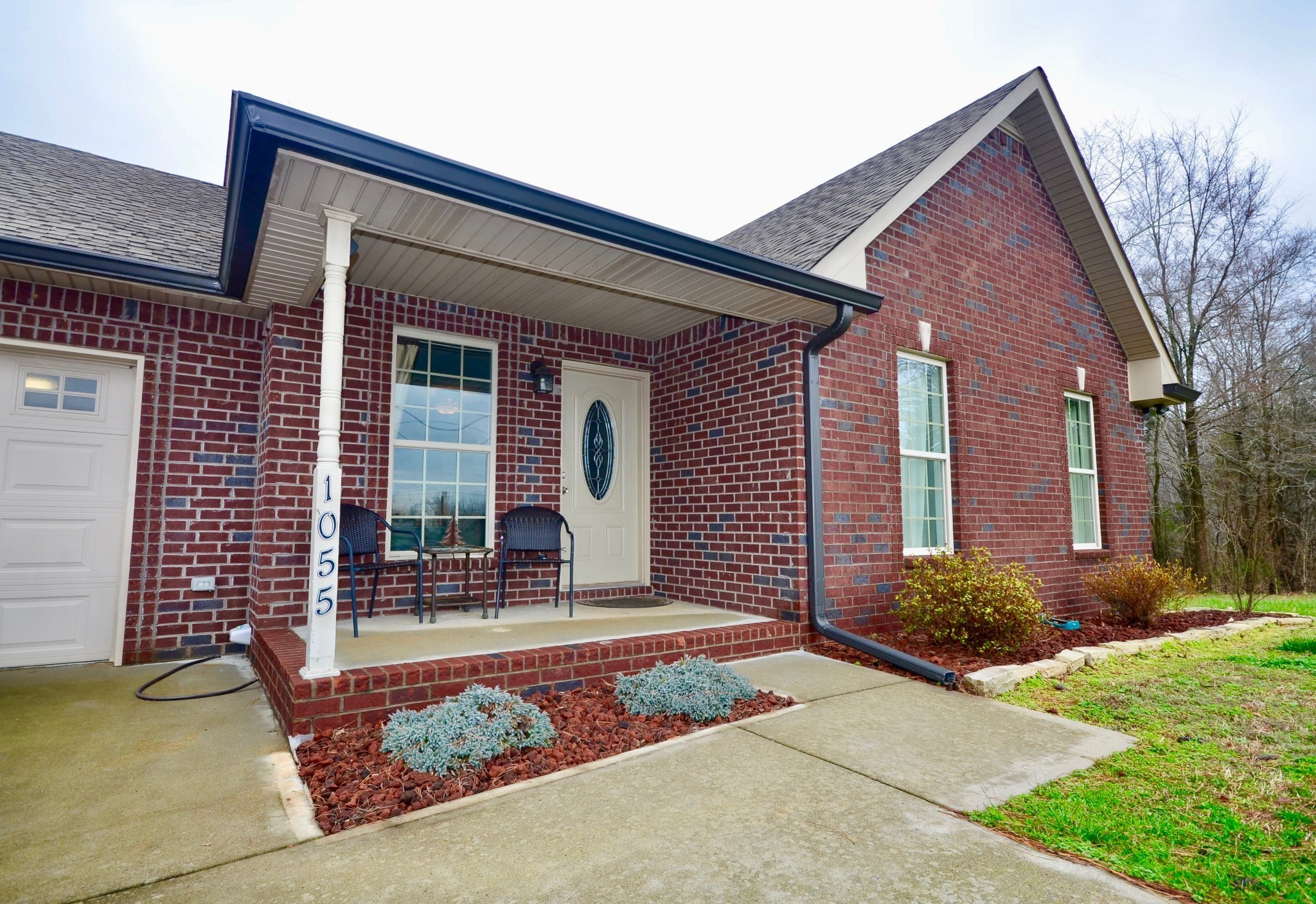 1055 Salem Ridge Road Clarksville, TN 37040 - Photo 1 of 18 a front view of a house with garden
