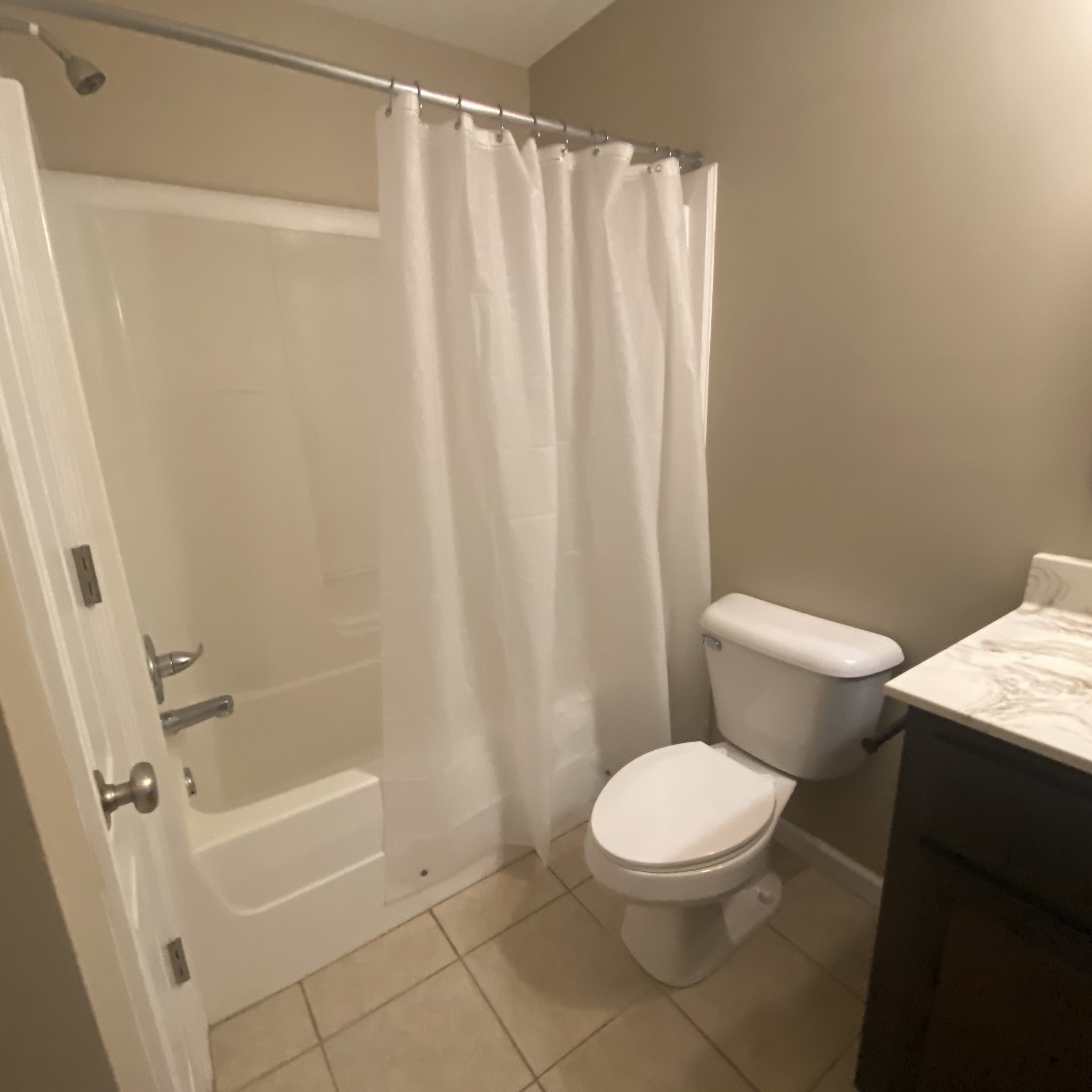 1055 Salem Ridge Road Clarksville, TN 37040 - Photo 16 of 18 a white toilet sitting next to a bath tub